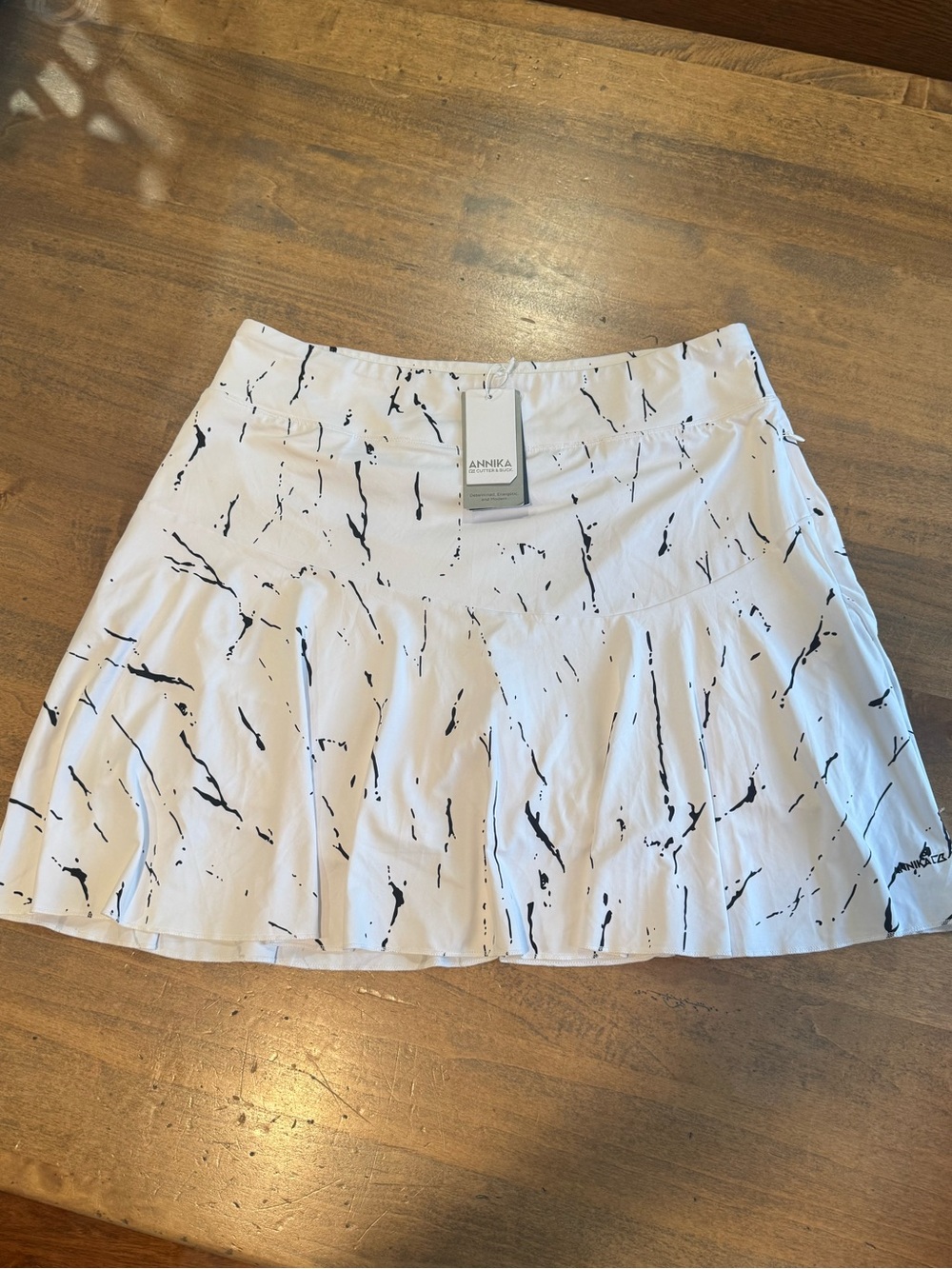 ANNIKA White Golf Skort with Black Splatter Print